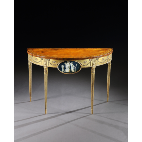 A George III Satinwood Marquetry Giltwood and Composition Demi-Line Side Table